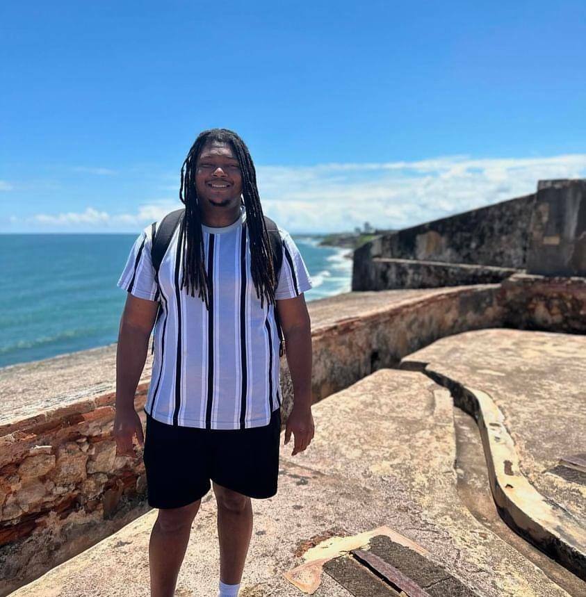 Matthias standing beside the ocean